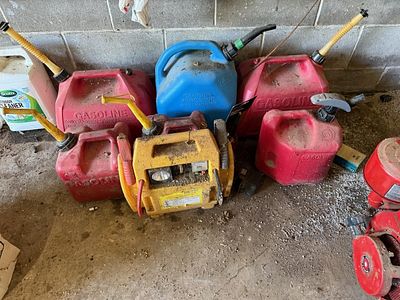A Collection of Portable Fuel Containers and a Chicago Electric Jumpstart System