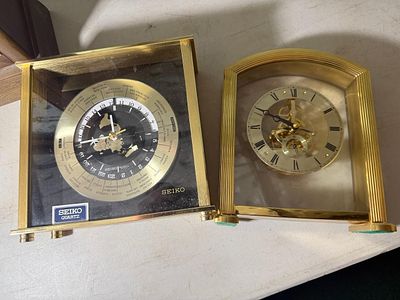 Two Seiko Quartz Brass-Tone Desk Clocks including World Time Model