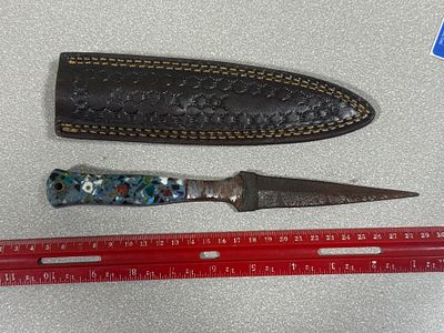 Damascus Steel Dagger with Multicolored Composite Handle and Stamped Leather Sheath. This knife 