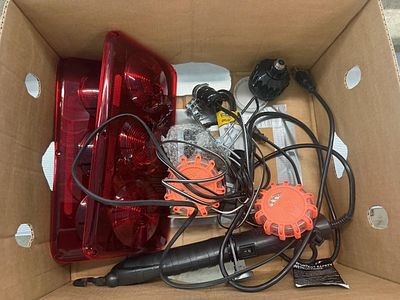 An Assortment of Trailer Lighting and Road Safety Equipment Including Tail Lights and LED Flares
