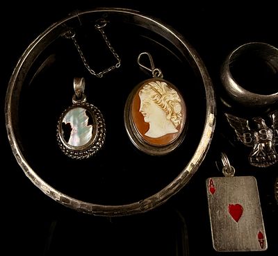 A Collection of Sterling Silver and Hand Carved Cameo Jewelry and Commemorative Items. A 