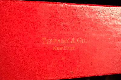 A Tiffany & Co. Red Holiday Presentation Box. A Tiffany & Co. red presentation box, l made of 