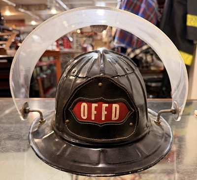 Cairns Mod 710 Black Old Forge Fire Department Helmet. A vintage Cairns & Brother metal fire 
