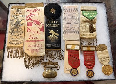 A Collection of Watertown New York State Firemen's and Fire Chiefs' Convention Ribbons, Badges 
