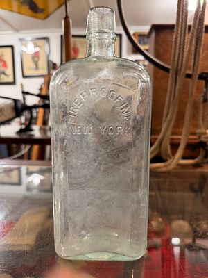 Antique Embossed 'FIREPROOFING NEW YORK' Glass Bottle, Late 19th/Early 20th Century. An antique 
