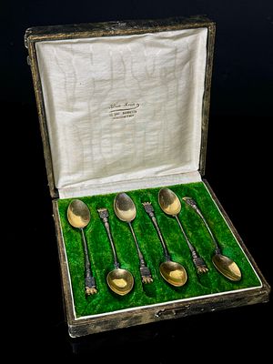 A Collection of Six Patinated Metal Souvenir Spoons with Gilt Bowls in Fitted Case. A collection 