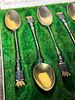 A Collection of Six Patinated Metal Souvenir Spoons with Gilt Bowls in Fitted Case. A collection Image - 1