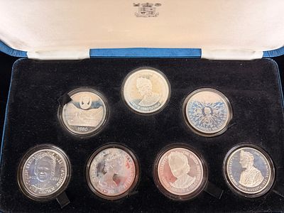 British Royal Mint 1980 Queen Mother 80th Birthday Seven Coin Silver Proof Set. A collection of 