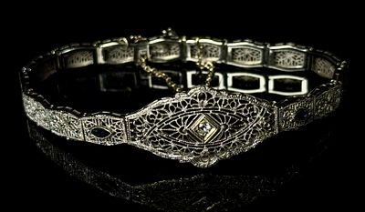 Art Deco 14K White Gold Diamond and Sapphire Filigree Link Bracelet. An Art Deco articulated 