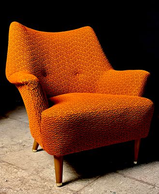 A Mid-Century Modern Upholstered High-Back Lounge Chair. A mid-century modern upholstered 