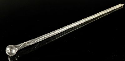 Clear Latticino Glass End of Day Parade Cane Fragment. A single, transparent glass object 