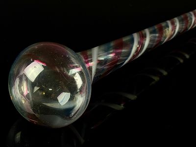 A Free-Blown End of Day Glass Parade Cane Whimsey. A single free-blown glass whimsey, identified 