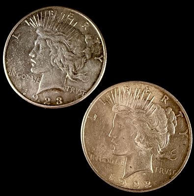 A Pair of United States Peace Silver Dollars, 1922 and 1923. A pair of United States Peace 