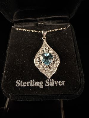 Sterling Silver Heart Cut Blue Topaz and White CZ Pendant Necklace. This contemporary sterling 