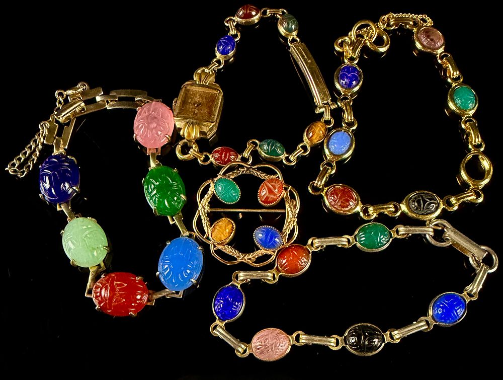 A Collection of 1960s Gold-Filled and Carved Stone Scarab Jewelry. This collection of mid-20th 