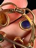 A Collection of 1960s Gold-Filled and Carved Stone Scarab Jewelry. This collection of mid-20th Image - 2