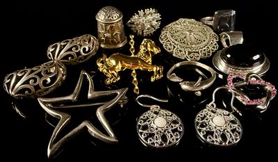 A Collection of Sterling Silver and Mixed-Metal Jewelry 1.78 Ozt. This group of jewelry includes 