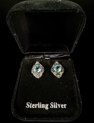 A Pair of Sterling Silver and Blue Topaz Heart-Cut Filigree Stud Earrings. This lot consists of 