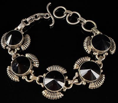 Vintage Sterling Silver and Black Onyx Link Bracelet. A sterling silver link bracelet featuring 