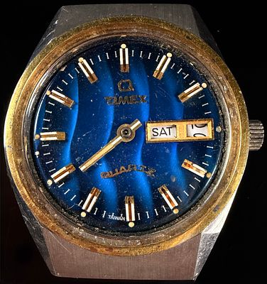 Vintage Q Timex Falcon Eye Quartz Wristwatch with Blue Wavy Dial. This is a vintage Q Timex 