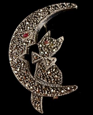 Sterling Silver and Marcasite Cat on Crescent Moon Figural Brooch. A sterling silver figural 