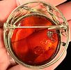 European .835 Silver and Baltic Amber Circular Openwork Brooch. A circular openwork brooch Image - 1