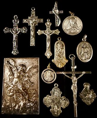A Collection of Religious Pendants, Crucifixes, and a Devotional Plaque. This collection 