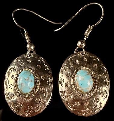 A Pair of Southwestern Style Silver-Toned and Turquoise Drop Earrings. A matched pair of drop 