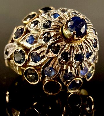 14 Karat Yellow Gold and Blue Sapphire Thai Princess Style Cocktail Ring. A 14 karat yellow gold 