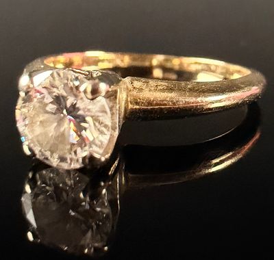 14 Karat Yellow Gold Solitaire Diamond Engagement Ring. This solitaire engagement ring features 