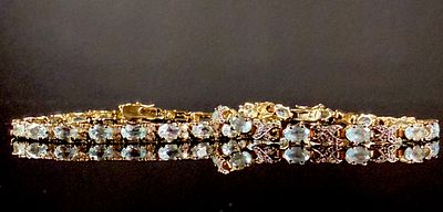 Two Light Blue Gemstone and Clear Accent Bracelets including 10K Yellow Gold Tennis Bracelet. Thi 