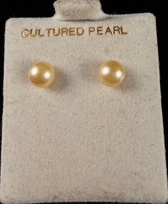 A Pair of 10k Gold and Cultured Pearl Stud Earrings. A matched pair of stud earrings featuring 