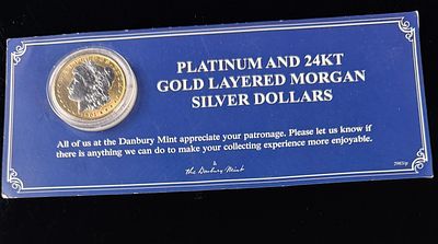 US 1901 Morgan Silver Dollar with Platinum and 24kt Gold Layering by the Danbury Mint. A 1901 US 