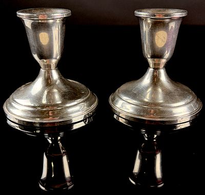 A Pair of Towle Sterling Silver Weighted Candlesticks. A pair of sterling silver candlesticks 