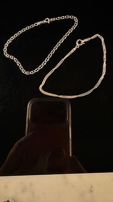 Two Sterling Silver Mariner and Twisted Link Bracelets. This lot consists of two sterling silver 