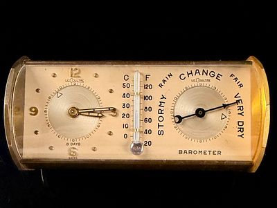 LeCoultre Gilt Metal 8-Day Barrel Desk Clock with Barometer and Thermometer. A mid-20th century 
