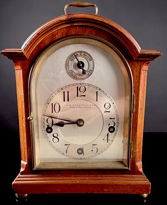 Junghans Mahogany Westminster Chime Mantel Clock Retailed by J.E. Caldwell and Co. A mahogany 