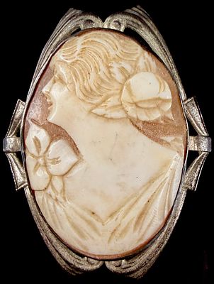 Art Deco Silver Tone Shell Cameo Brooch with Openwork Frame. An Art Deco period jewelry piece 