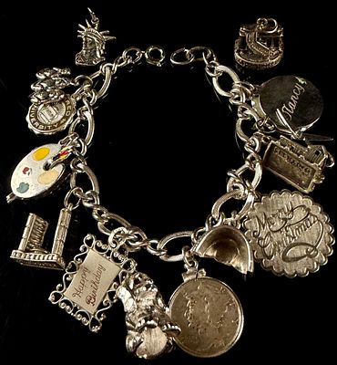 Vintage Sterling Silver Double Link Charm Bracelet with Fourteen Charms. A vintage sterling 