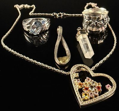 An Assortment of Sterling Silver Jewelry Including a Multi-Gemstone Heart Pendant and Designer Rings