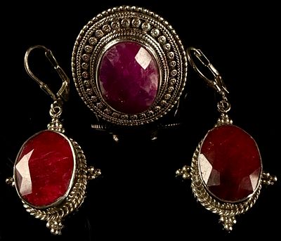 A Trio of Sterling Silver and Faceted Ruby-Tone Corundum Jewelry. This suite of artisan jewelry 