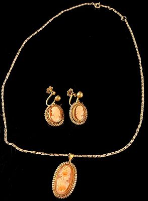 A Vintage Shell Cameo Demi-Parure of a Pendant Necklace and Screw-Back Earrings. A vintage shell 