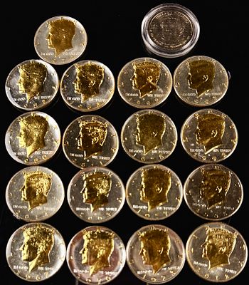 A Group of US Kennedy Half Dollars and a Presidential $1 Coin. This collection of United States 