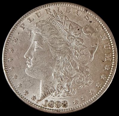 US 1898 Morgan Silver Dollar. US 1898 Morgan silver dollar struck at the Philadelphia Mint. This 