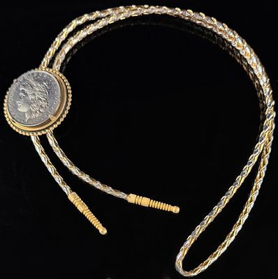 Vintage Western 1889 Morgan Silver Dollar Bolo Tie. A Western-style bolo tie featuring an 