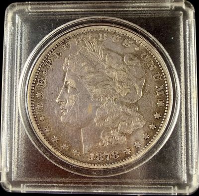 US 1878 Morgan Silver Dollar, 7 Tail Feathers Variety. One US 1878 Morgan Silver Dollar struck 