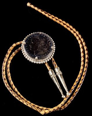 Vintage 1897 United States Morgan Silver Dollar Bolo Tie. This Western-style bolo tie features 