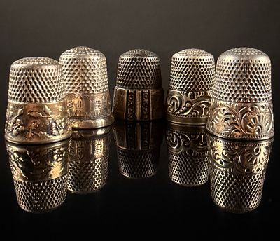 A Collection of Sterling Silver Sewing Thimbles Including Simons Bros. Co. A collection of 