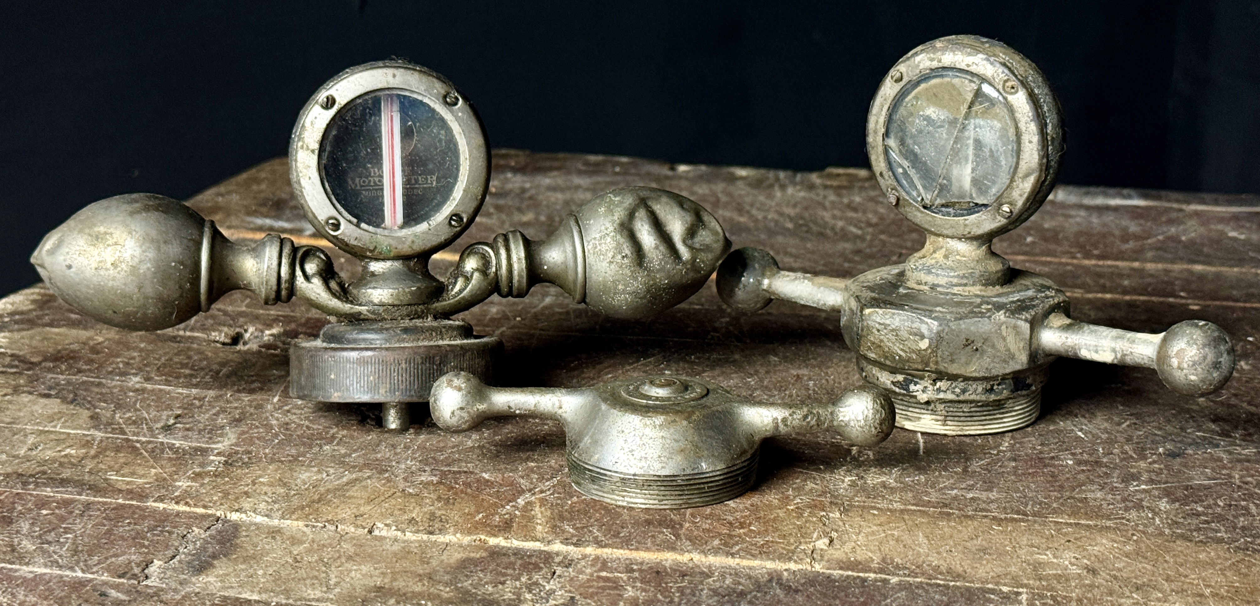 A Trio of Vintage Boyce Moto-Meter Radiator Caps and Temperature Gauges