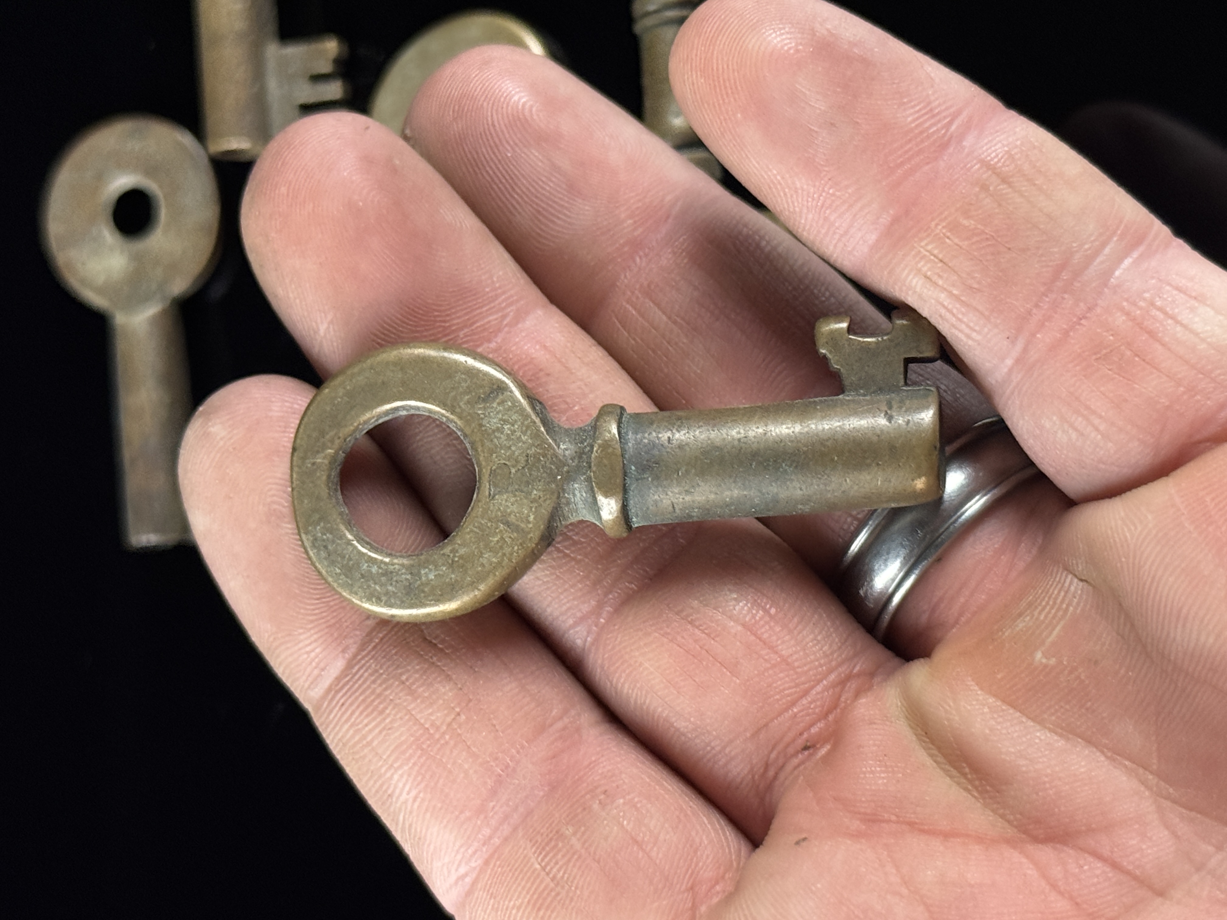 An Assortment of Antique Brass Railroad and Industrial Cabinet Keys including S.R.M. Mfg. Co.